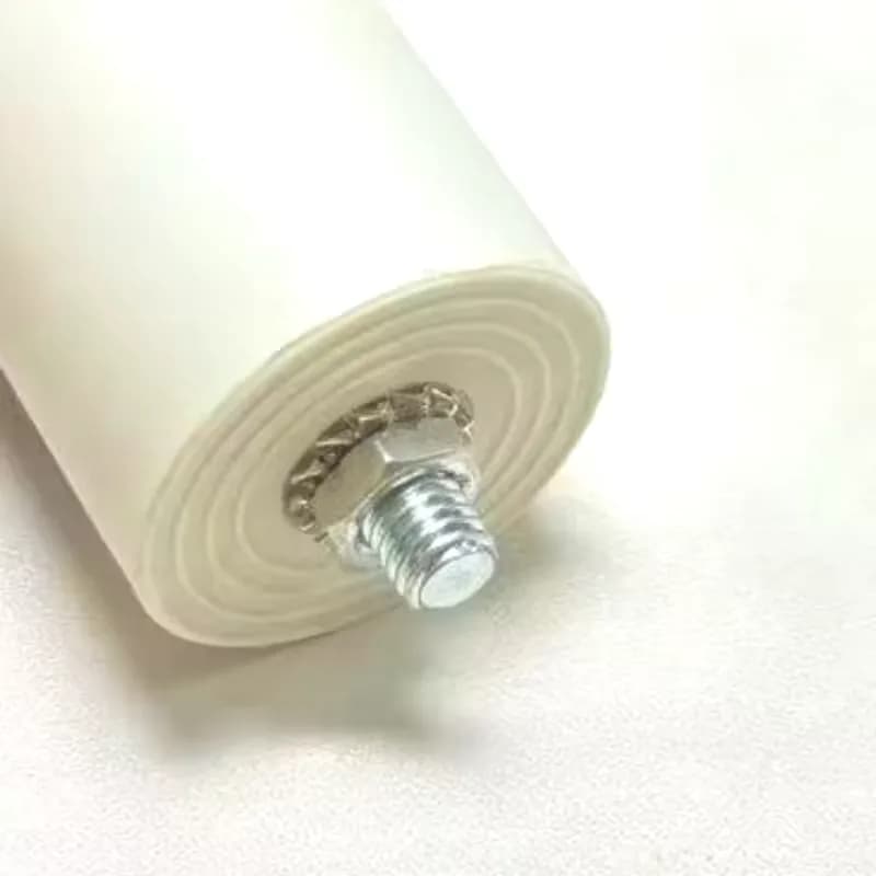 Threaded stud-mount base of a CBB60 motor run capacitor